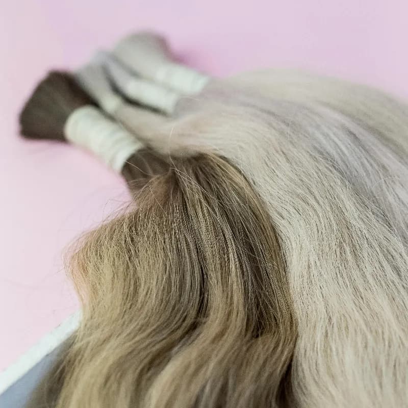 Long, full hair extensions blended and styled at Vibe Hair Studio