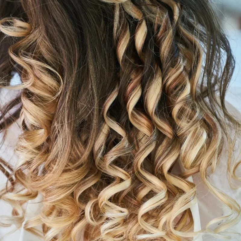 Soft modern perm with natural looking waves at Vibe Hair Studio