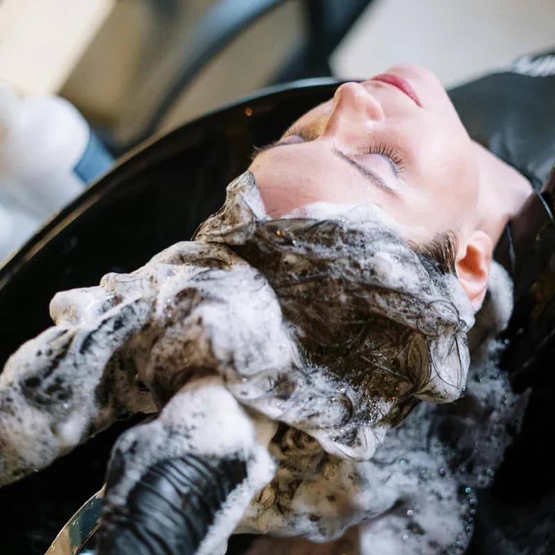 Deep conditioning hair treatment being applied at Vibe Hair Studio