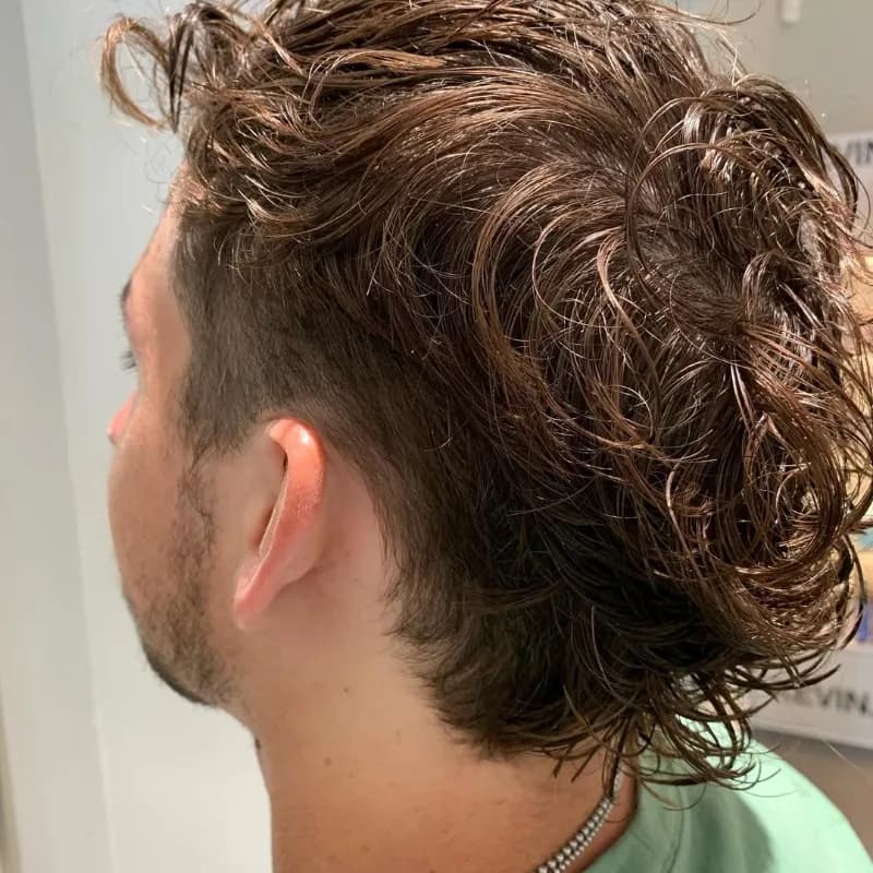 Men's haircut on curly hair finished at Vibe Hair Studio